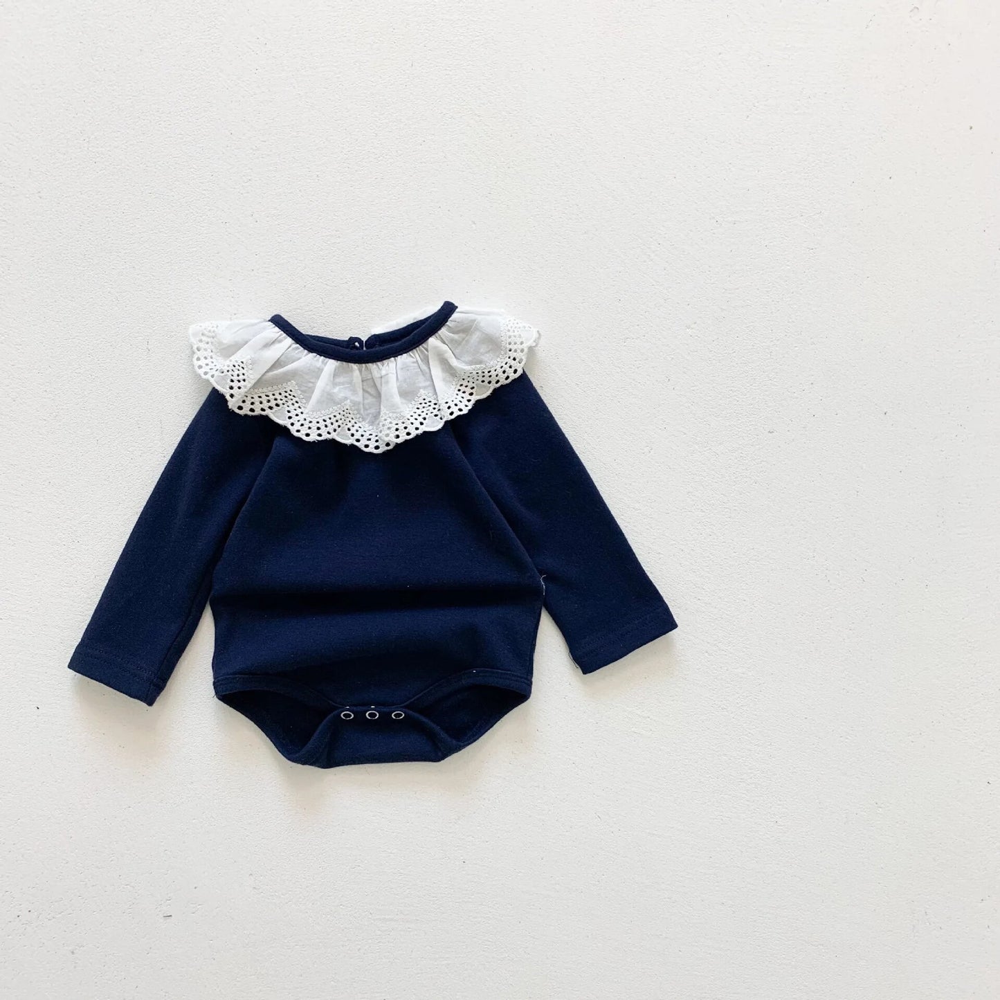 NAVY FRILL BODYSUIT