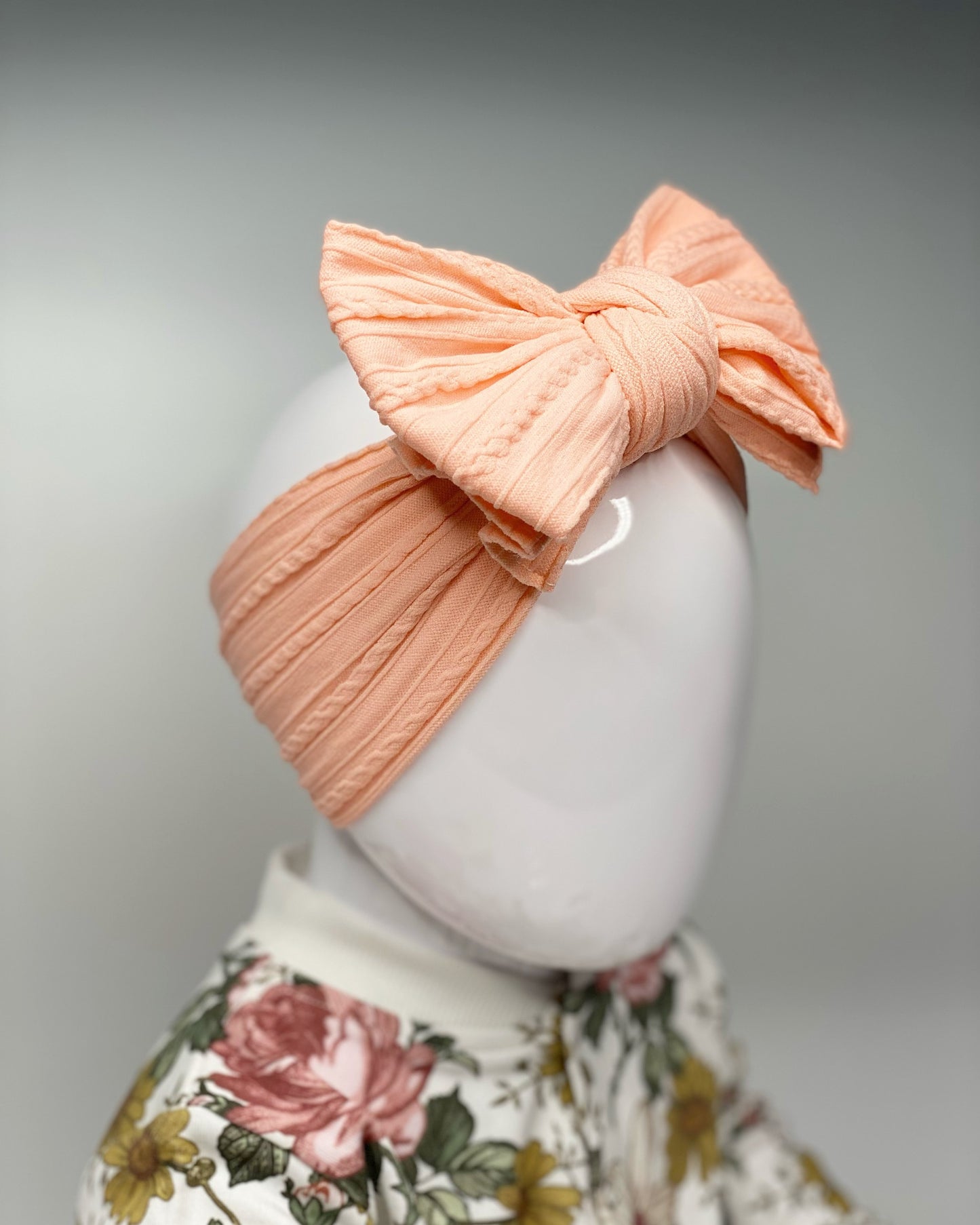 PEACH LARGE CABLE KNIT BOW