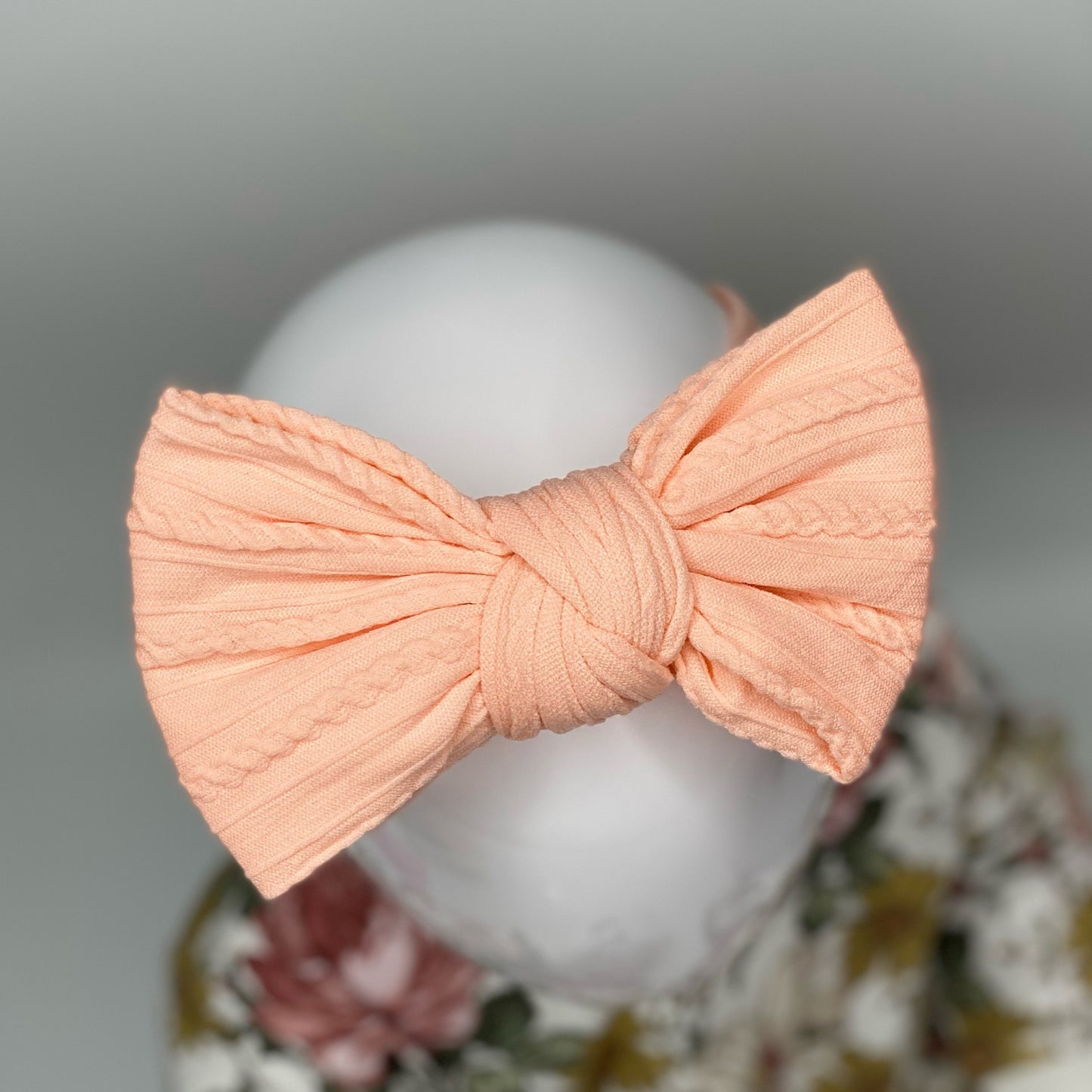 PEACH LARGE CABLE KNIT BOW